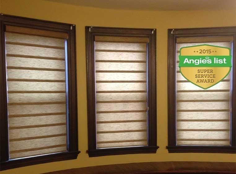 Three windows with shades.
